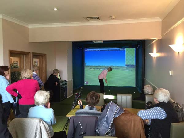 Lady golfers using the Golf Simulator