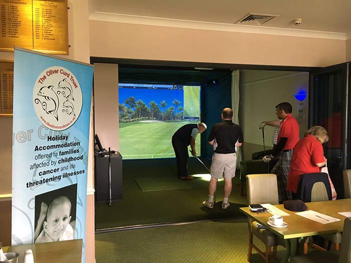 Charity fundraising with a smart golf simulator competition